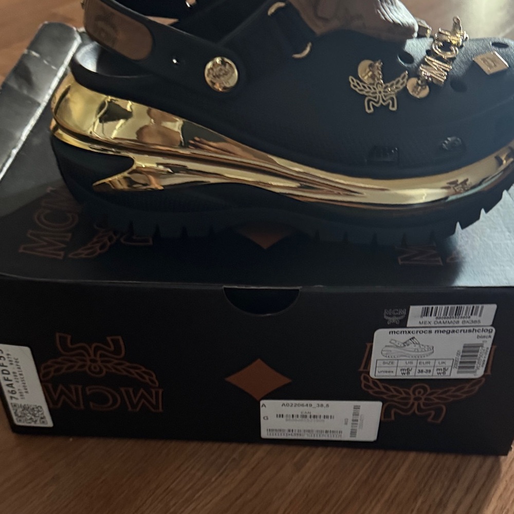 MCM Women's Black and Gold Clogs